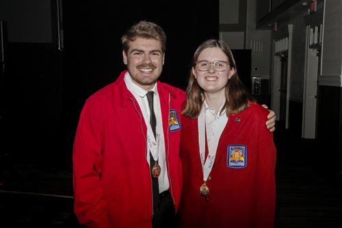 Christian and Samantha pose in their red SkillsUSA jackets after winning states